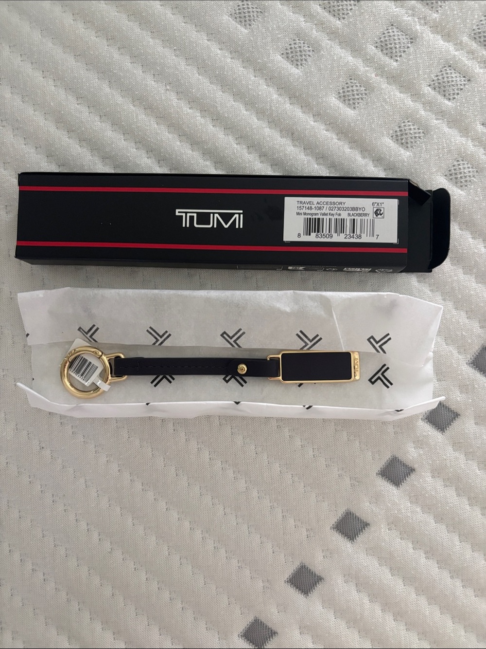 Tumi Blackberry Leather Key Holder with Gold Hardware